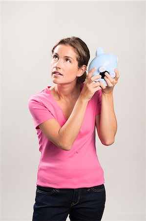 save the day - Woman with a money box Stock Photo - Premium Royalty-Free, Code: 6102-05655520