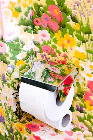 room interior multi colors - Toilet paper in flowery bathroom Stock Photo - Premium Royalty-Free, Code: 6102-05603698