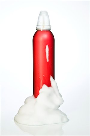 perfume bottle on white - Hair mousse in aerosol can Stock Photo - Premium Royalty-Free, Code: 6102-05603719