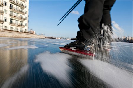 simsearch:6102-05603693,k - Low section of person ice skating Stock Photo - Premium Royalty-Free, Code: 6102-05603738