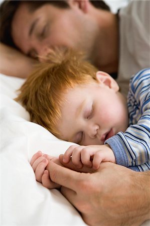 Father and son sleeping, Sweden. Stock Photo - Premium Royalty-Free, Code: 6102-05786687
