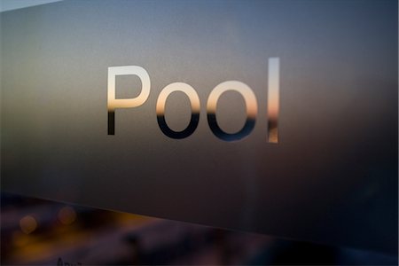 swimmingpool inside nobody - Swimming pool sign on glass Stock Photo - Premium Royalty-Free, Code: 6102-05802552