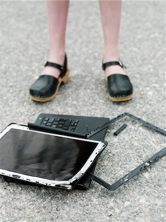 damaged shoe - Girl with broken laptop Stock Photo - Premium Royalty-Free, Code: 6102-05802667