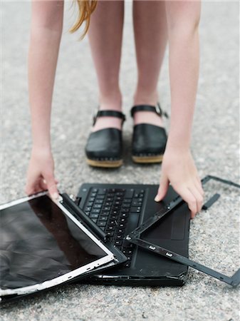 damaged shoe - Girl with broken laptop Stock Photo - Premium Royalty-Free, Code: 6102-05802668