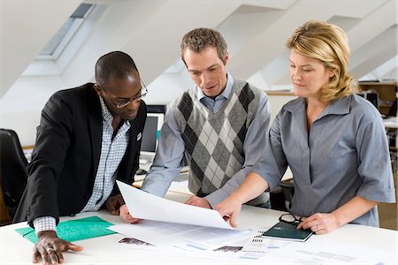 simsearch:6102-06026005,k - Business people working together in office Stock Photo - Premium Royalty-Free, Code: 6102-05955987