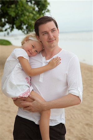 Father and daughter on beach, Bali. Stock Photo - Premium Royalty-Free, Code: 6102-06025873