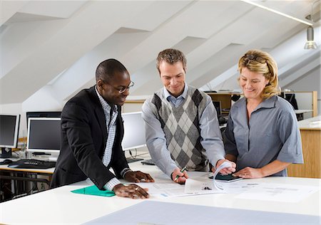 simsearch:6102-06026005,k - Coworkers having discussion in office Stock Photo - Premium Royalty-Free, Code: 6102-06025980