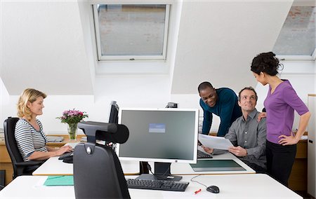 simsearch:6102-06026005,k - Coworkers together in office Stock Photo - Premium Royalty-Free, Code: 6102-06025990