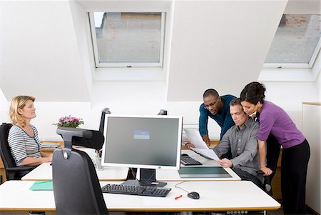 simsearch:6102-06026005,k - Coworkers together in office Stock Photo - Premium Royalty-Free, Code: 6102-06025991