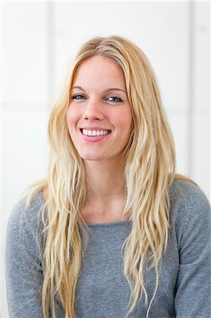 sweden woman business - Portrait of blonde woman smiling indoors Stock Photo - Premium Royalty-Free, Code: 6102-06026040