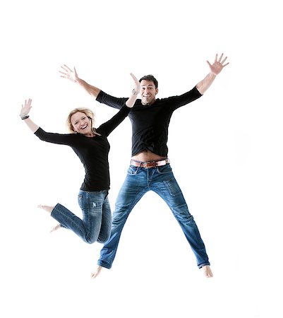 positive - Young couple jumping together in joy Stock Photo - Premium Royalty-Free, Code: 6102-06026083