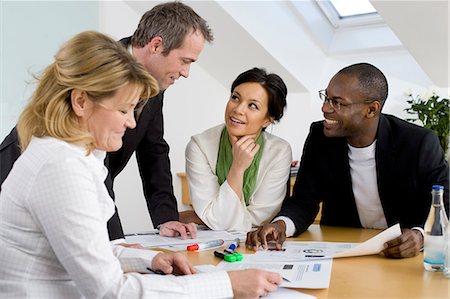 simsearch:6102-06026005,k - Business team at meeting Stock Photo - Premium Royalty-Free, Code: 6102-06026007