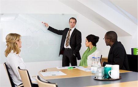 simsearch:6102-06026005,k - Business team at meeting Stock Photo - Premium Royalty-Free, Code: 6102-06026005