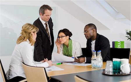 simsearch:6102-08881555,k - Business team at meeting Stock Photo - Premium Royalty-Free, Code: 6102-06026006
