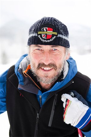 Portrait of smiling skier Stock Photo - Premium Royalty-Free, Code: 6102-06026036