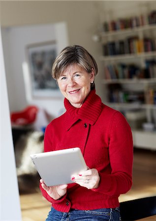 Portrait of mature woman with digital tablet Stock Photo - Premium Royalty-Free, Code: 6102-06026145