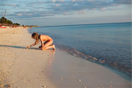 preteen girls in the sand - Girl on beach Stock Photo - Premium Royalty-Free, Code: 6102-06374483