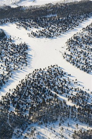 simsearch:6102-08520513,k - Aerial view of crossroads covered by snow at winter Stock Photo - Premium Royalty-Free, Code: 6102-06374543