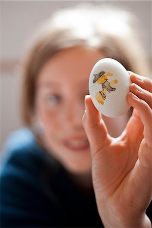 easter people - Girl holding painted Easter egg Stock Photo - Premium Royalty-Free, Code: 6102-06374538