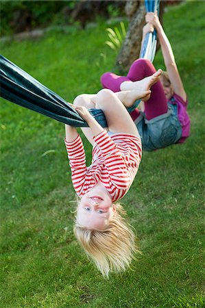 person upside down - Two sisters hanging on hammock Stock Photo - Premium Royalty-Free, Code: 6102-06336524