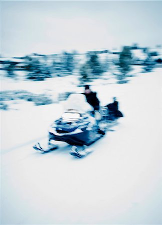 simsearch:6102-04929303,k - Man on snowmobile Foto de stock - Sin royalties Premium, Código: 6102-06336886