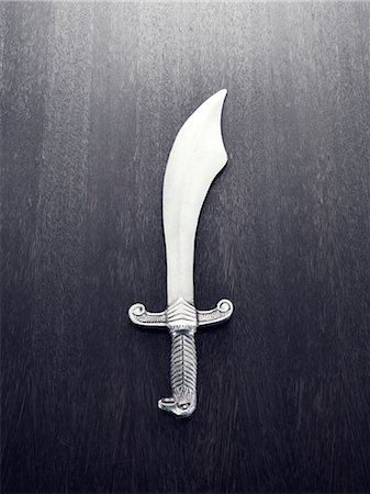 sword - Pirates sword on grey background Stock Photo - Premium Royalty-Free, Code: 6102-06336800