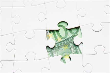 euro photography - Jigsaw puzzle revealing euro banknote Stock Photo - Premium Royalty-Free, Code: 6102-06336973