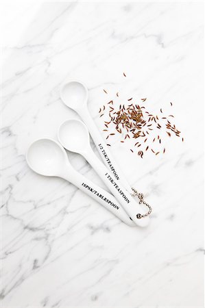 spices white - Teaspoons and caraway Seeds Stock Photo - Premium Royalty-Free, Code: 6102-06337054