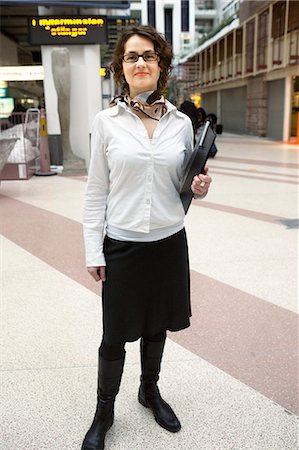simsearch:6102-03865784,k - Portrait of a hostess at a station, Stockholm, Sweden. Foto de stock - Sin royalties Premium, Código: 6102-06470472