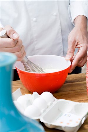 pancake bake - Woman whipping eggs. Stock Photo - Premium Royalty-Free, Code: 6102-06470411