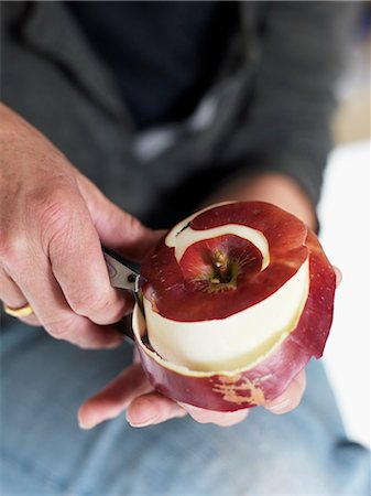 simsearch:6102-08520668,k - Woman peeling an apple, Sweden. Stock Photo - Premium Royalty-Free, Code: 6102-06470524