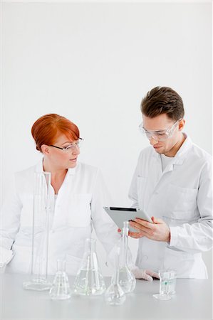 simsearch:6102-06470881,k - Two scientists working in laboratory Stock Photo - Premium Royalty-Free, Code: 6102-06470889