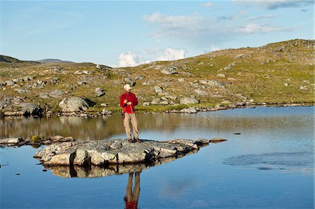 simsearch:6102-07843772,k - Man fly fishing in creek Stock Photo - Premium Royalty-Free, Code: 6102-06470803