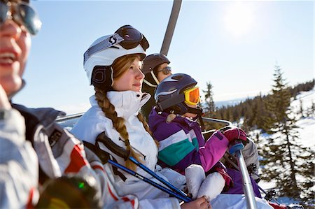 four people skiing - Family on ski lift Stock Photo - Premium Royalty-Free, Code: 6102-06470952