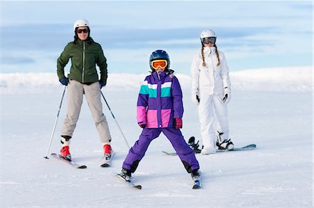 snow skiing family - Mother and two daughters skiing Stock Photo - Premium Royalty-Free, Code: 6102-06470959