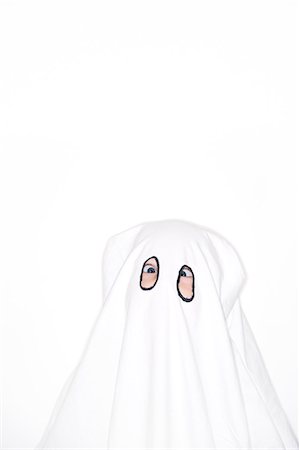 frighten - Child in ghost costume, studio shot Stock Photo - Premium Royalty-Free, Code: 6102-06470969
