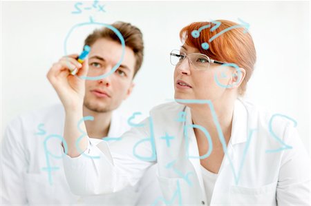 simsearch:6102-06470881,k - Two scientists working in laboratory Stock Photo - Premium Royalty-Free, Code: 6102-06470917