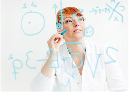 single word - Female scientist working in laboratory Stock Photo - Premium Royalty-Free, Code: 6102-06470918