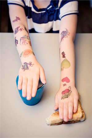 simsearch:6108-06908067,k - Fake tattoos on childs arms Stock Photo - Premium Royalty-Free, Code: 6102-06471019