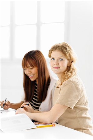 student meeting - Two female students studying in library Stock Photo - Premium Royalty-Free, Code: 6102-06471109