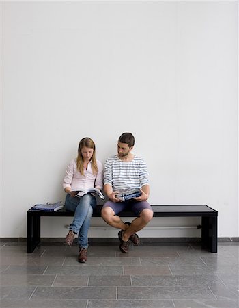 female sitting on white - Young students sitting on bench Stock Photo - Premium Royalty-Free, Code: 6102-06471219