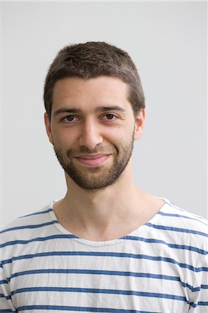 studying - Portrait of smiling young man Photographie de stock - Premium Libres de Droits, Code: 6102-06471225