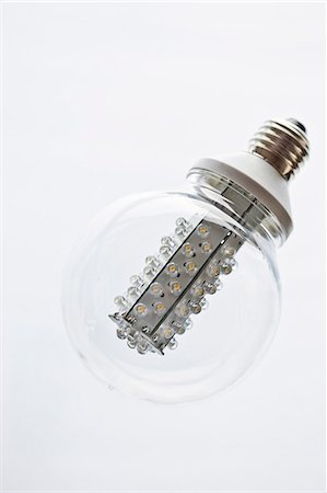 electric light - Light bulb on white background, studio shot Foto de stock - Sin royalties Premium, Código: 6102-06777564