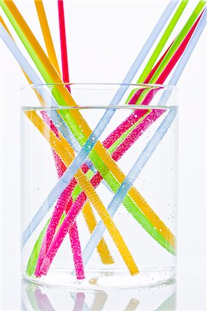 drinking glass studio shot - Colorful drinking straws in glass of water Stock Photo - Premium Royalty-Free, Code: 6102-06777583