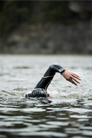 sports and swimming - Close- up of woman swimming Stock Photo - Premium Royalty-Free, Code: 6102-06777668