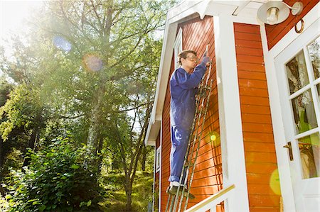 repairs - Young man repairing facade Stock Photo - Premium Royalty-Free, Code: 6102-06965429