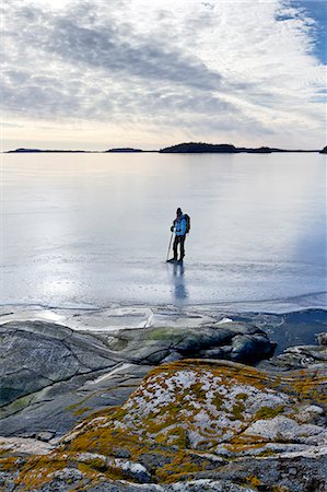 stockholm archipelago - Person skating at frozen sea Photographie de stock - Premium Libres de Droits, Code: 6102-06965693