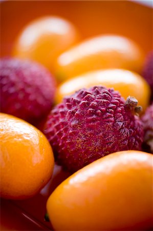 Close-up of kumquats and leeches Photographie de stock - Premium Libres de Droits, Code: 6102-07157970