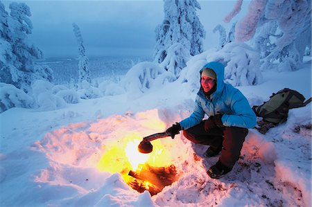fire (things burning controlled) - Woman having campfire at winter Stock Photo - Premium Royalty-Free, Code: 6102-07158042
