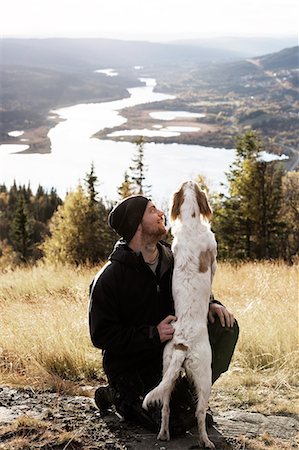 Man with dog Foto de stock - Sin royalties Premium, Código: 6102-07158073